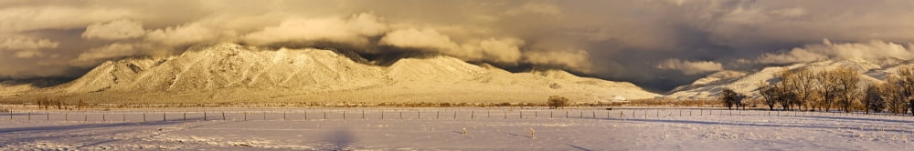 Pasture land covered in snow at sunset with Taos Mountain in the background Sangre De Cristo Range San Luis Valley Colorado USA Canvas Art - Panoramic Images (22 x 4)