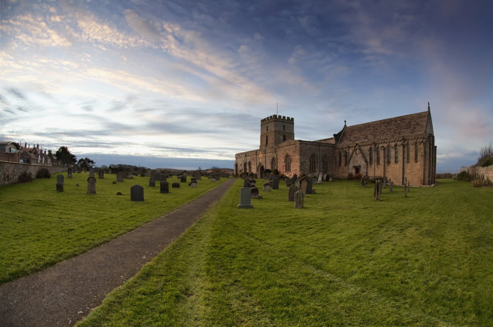 Path Leading To A Church Building And Cemetery Bamburgh Northumberland England Canvas Art - John Short Design Pics (38 x 24)