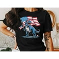 thumbnail image 1 of Patriotic Dinosaur T-Shirt, USA Flag T-Rex Graphic Tee, Funny 4th of July Shirt for Kids and Adults, Independence Day Gift Shirt, 1 of 5