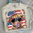 thumbnail image 1 of Patriotic Highland Cow Printed Unisex T-Shirt – Retro USA Flag 4th of July Americana Western Graphic Tee for Men and Women, 1 of 5