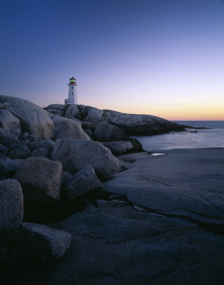 Peggys Cove Lighthouse in the evening along the rocky coast of Nova Scotia Canada Canvas Art - Panoramic Images (36 x 29)