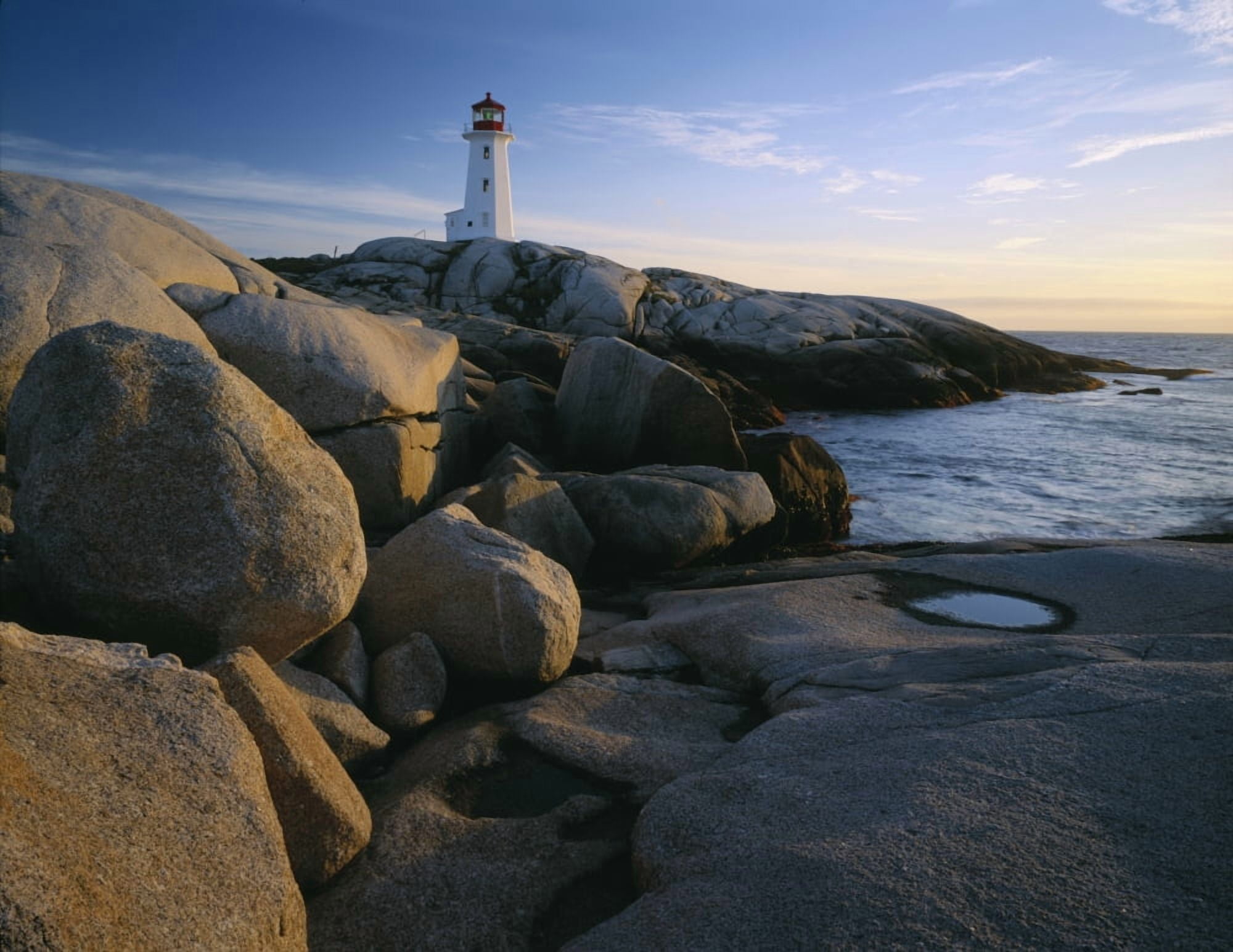 Peggys Cove Lighthouse in the evening on the Atlantic coast of Nova Scotia Canada Canvas Art - Panoramic Images (9 x 27)