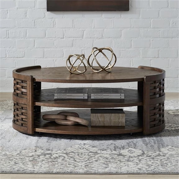 Pemberly Row Oval Cocktail Table with Casters and Shelves in Brown Oak Wood