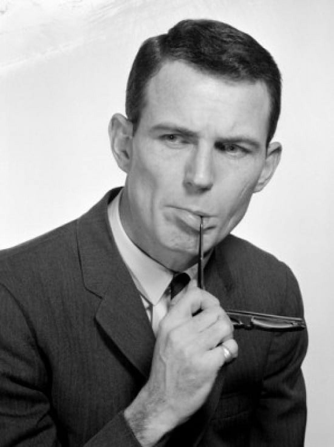 Pensive businessman biting glasses Canvas Art - (18 x 24)