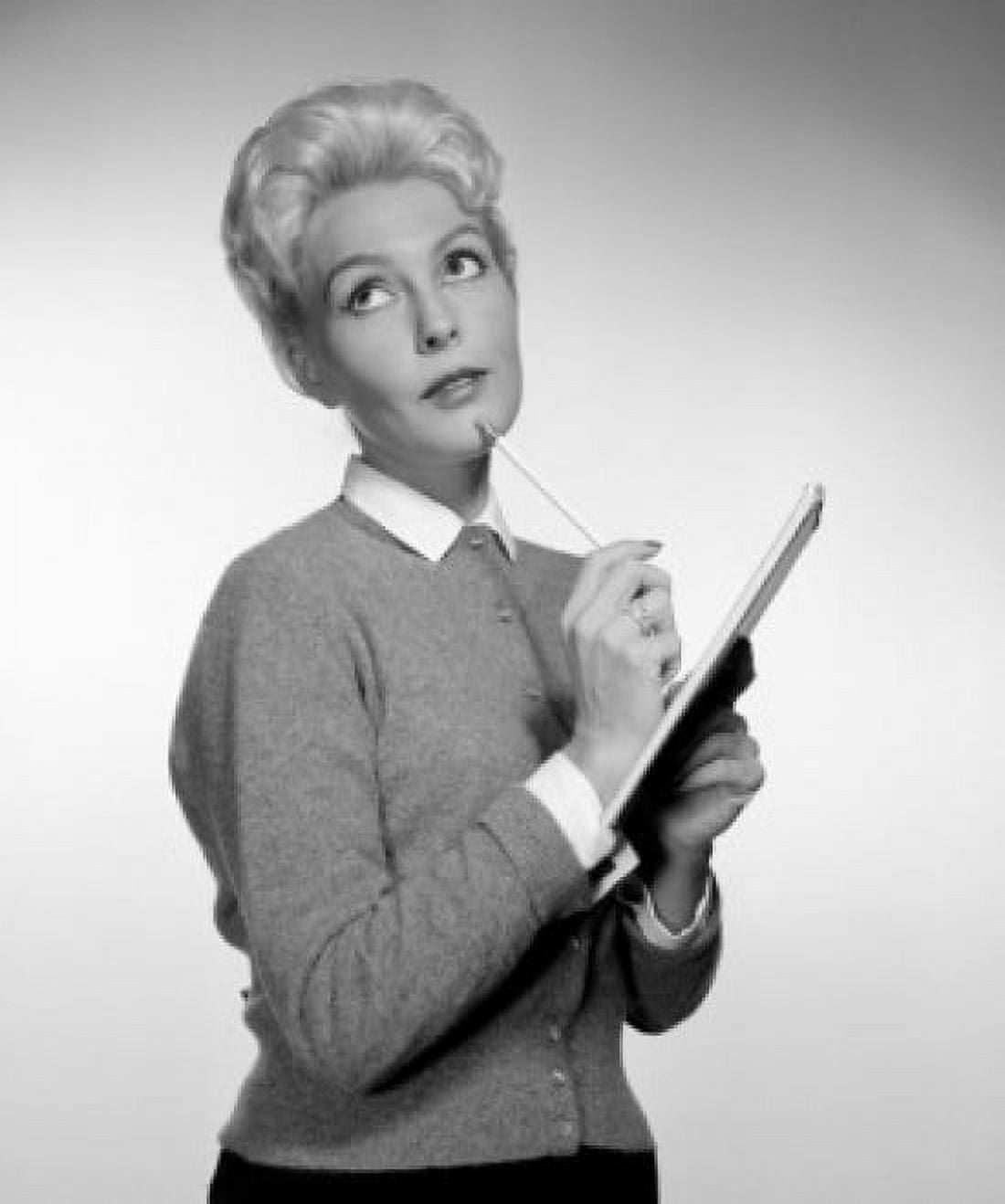 Pensive secretary holding clipboard Canvas Art - (18 x 24)