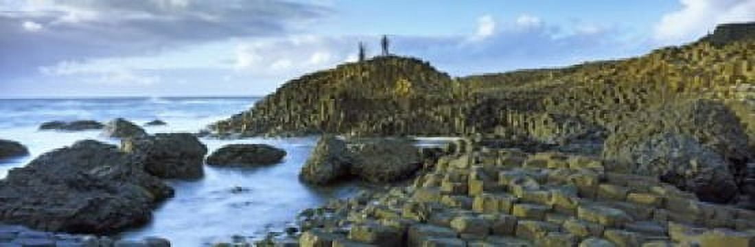 People climbing on rocks at Giants Causeway Bushmills County Antrim Northern Ireland Canvas Art - Panoramic Images (36 x 12)