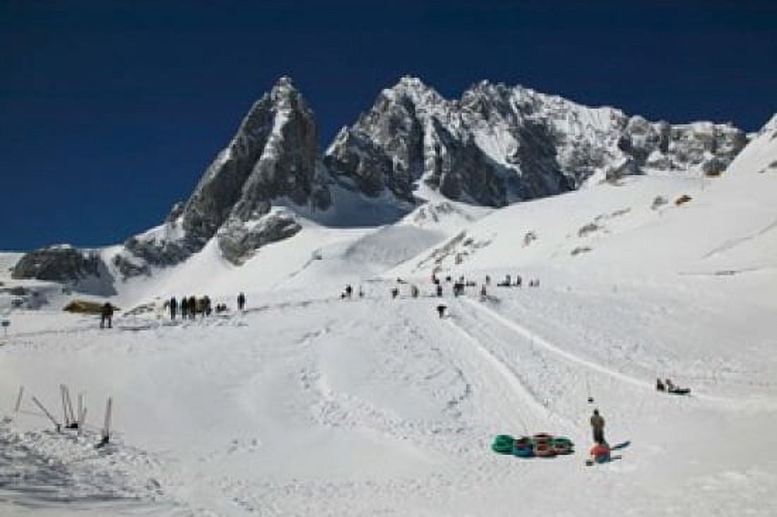 People enjoying snow tubing at Jade Dragon Snow Mountain Lijiang Yunnan Province China Canvas Art - Panoramic Images (36 x 24)