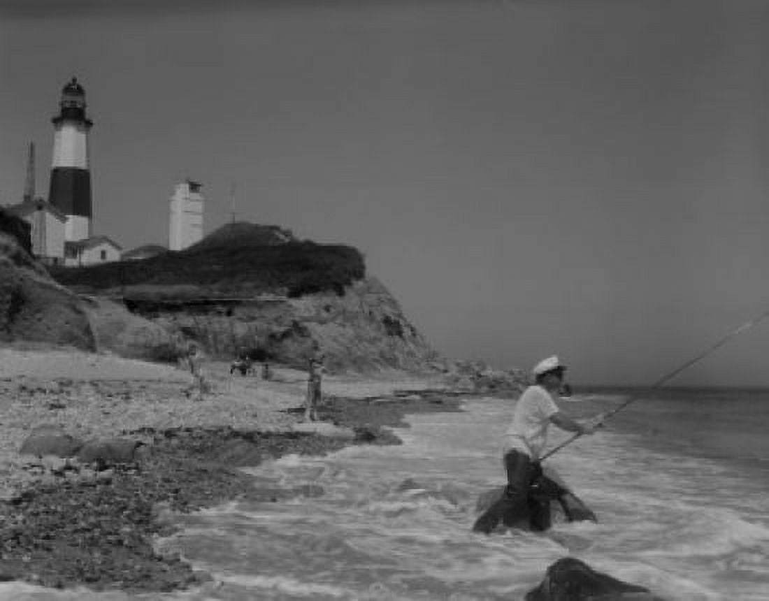People fishing on seaside lighthouse in the background Canvas Art - (18 x 24)