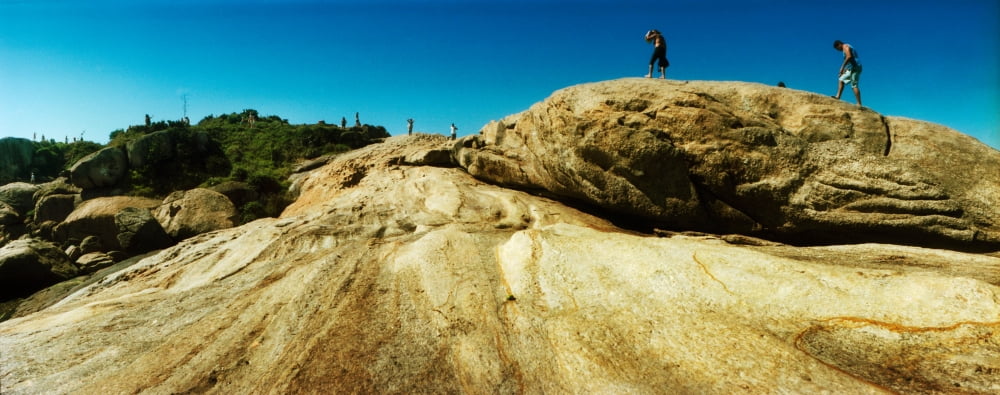 People hiking along the boulders that separate Copacabana and Ipanema Beach Rio de Janeiro Brazil Canvas Art - Panoramic Images (27 x 9)