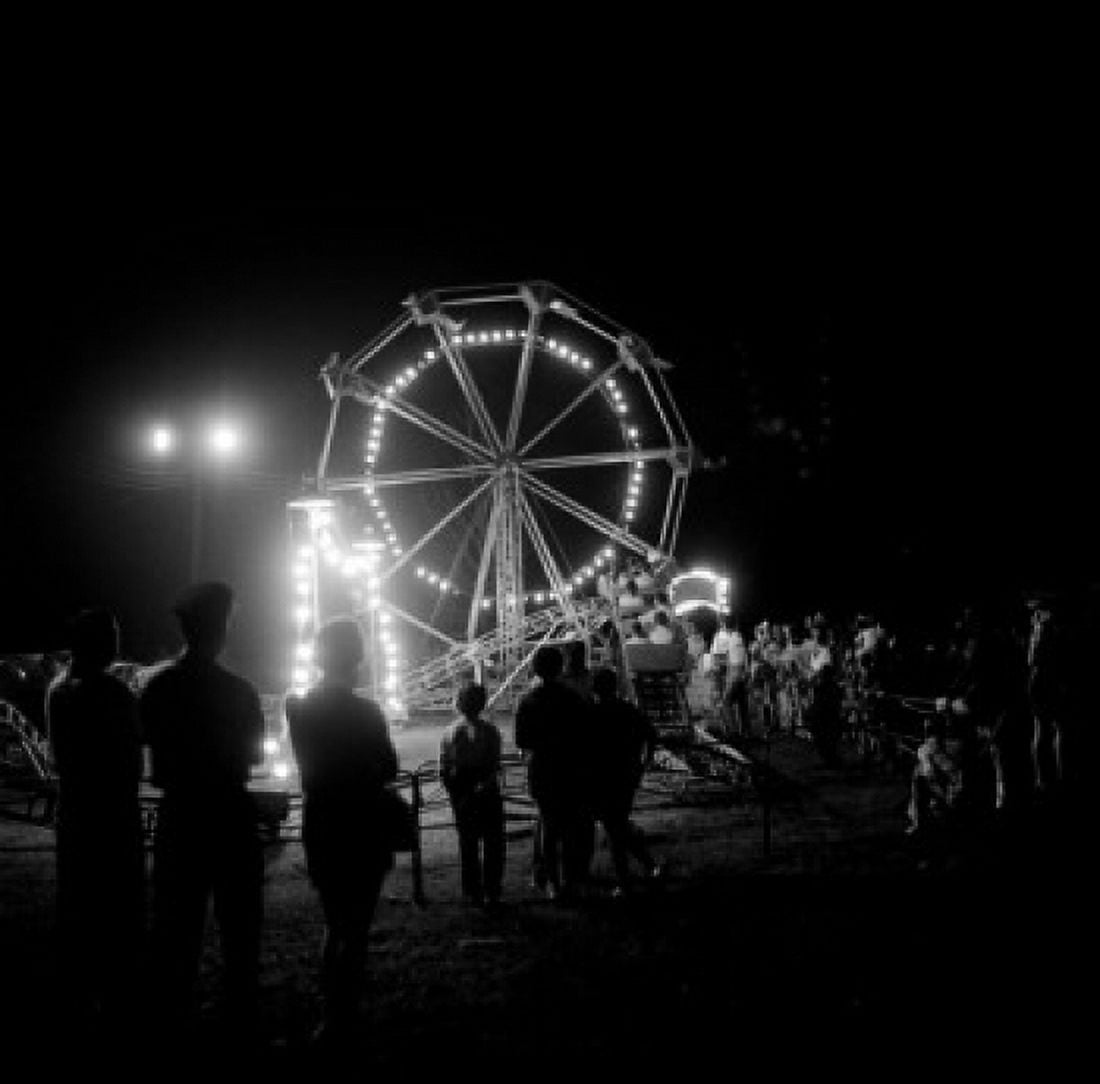 People in amusement park at night Canvas Art - (18 x 24)