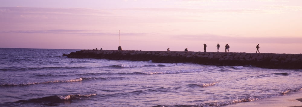 People on a jetty in the sea Sitges Barcelona Catalonia Spain Canvas Art - Panoramic Images (27 x 9)