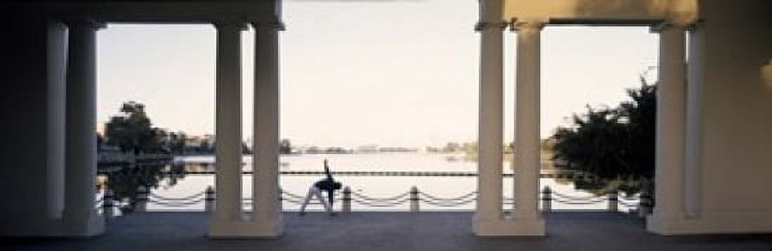 Person stretching near colonnade Lake Merritt Oakland Alameda County California USA Canvas Art - Panoramic Images (18 x 6)