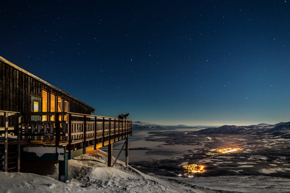 Person viewing the stars at The Abisko Sky Station Abisko Lapland Sweden Cold temperatures as low as -47 celsius Canvas Art - Panoramic Images (27 x 9)