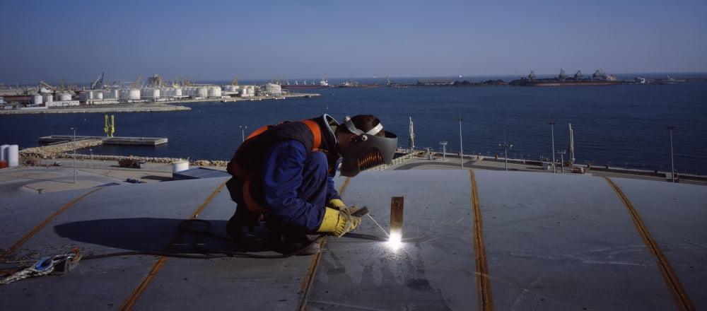 Person welding in a chemical plant Tarragona Tarragona Province Catalonia Spain Canvas Art - Panoramic Images (36 x 12)