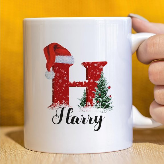 Personalized Letter H Christmas Mug Harry Custom Name Coffee Cup with Santa Hat and Pine Tree Design Festive Holiday Ceramic Mug for Hot Cocoa, Tea, and Seasonal Gift Exchange