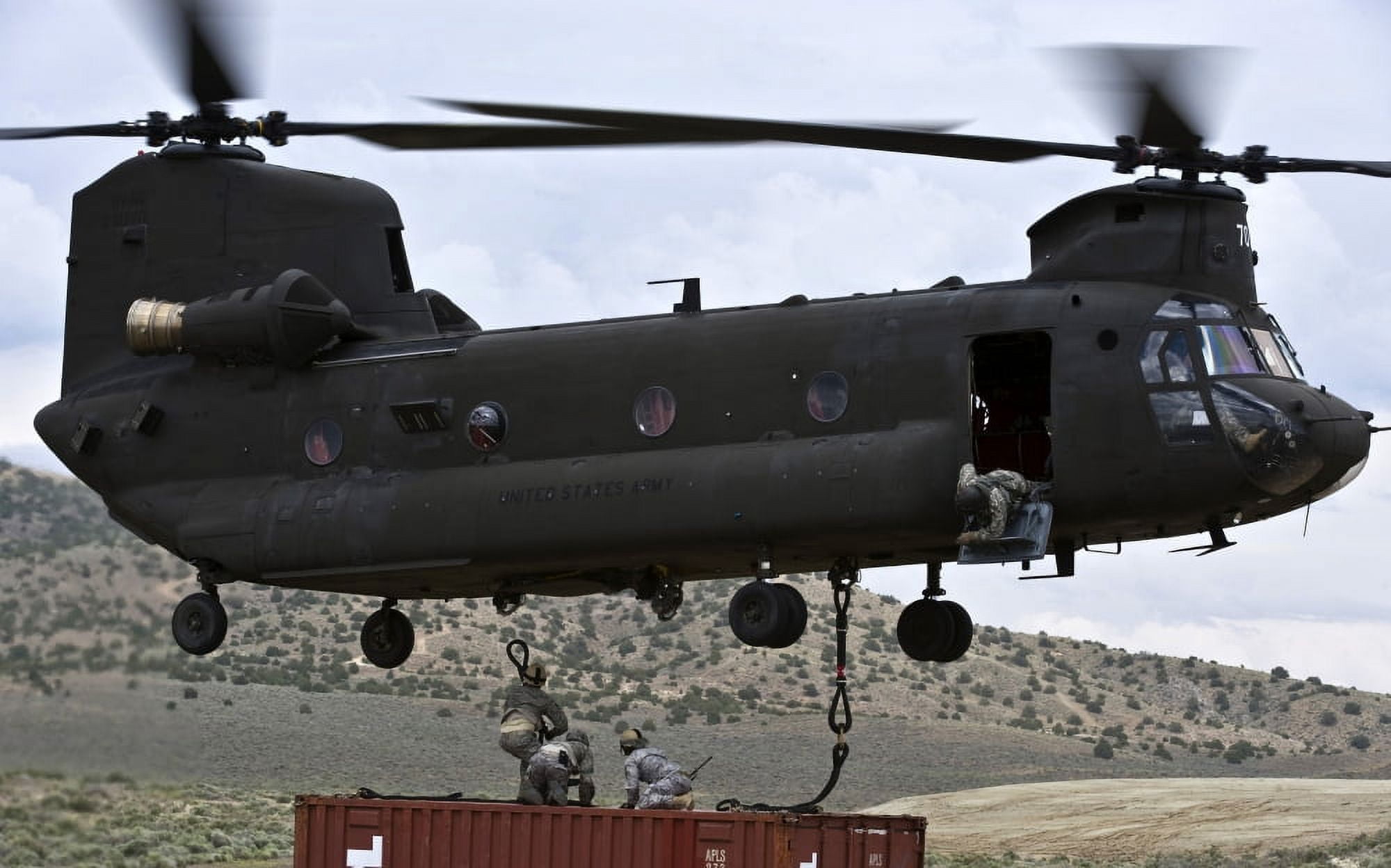 Personnel attach a storage container to a CH-47 Chinook helicopter Canvas Art - Stocktrek Images (36 x 23)