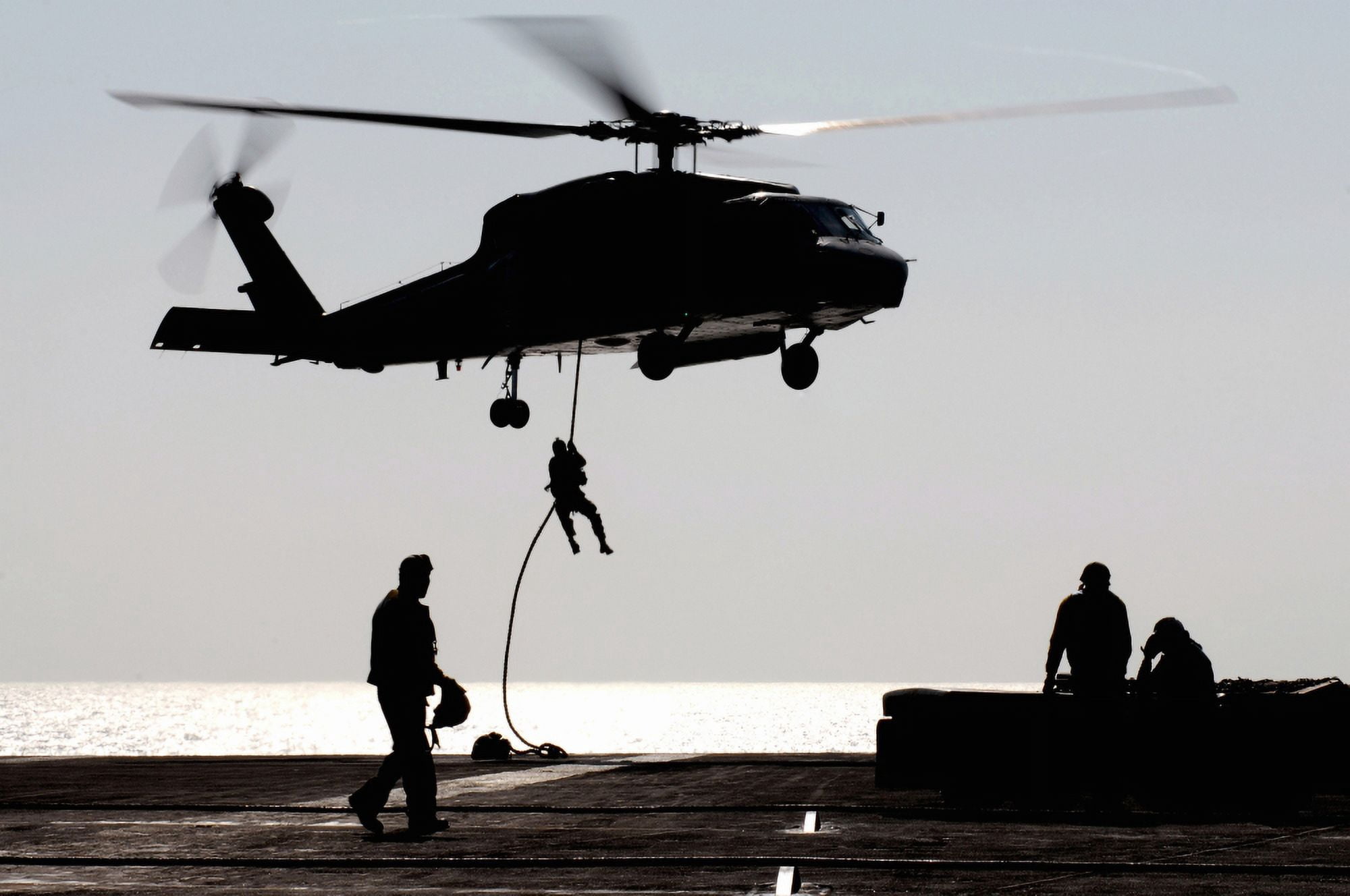 Personnel fast-rope out of an SH-60F Seahawk helicopter Canvas Art - Stocktrek Images (34 x 23)