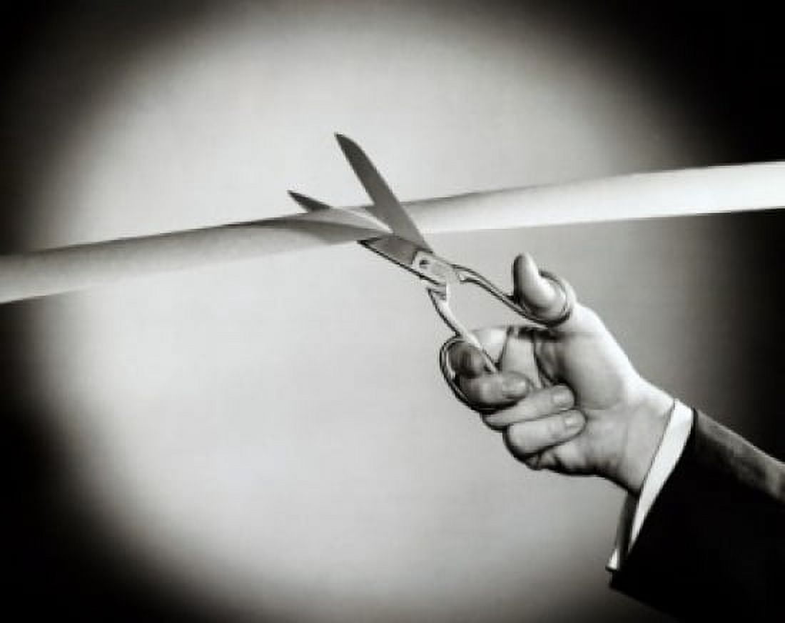 Persons hand cutting a ribbon with a pair of scissors Canvas Art - (18 x 24)