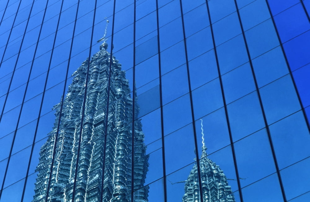 Petronas Towers Reflected In Nearby Office Buildings Canvas Art - Martin Stolworthy Design Pics (38 x 24)