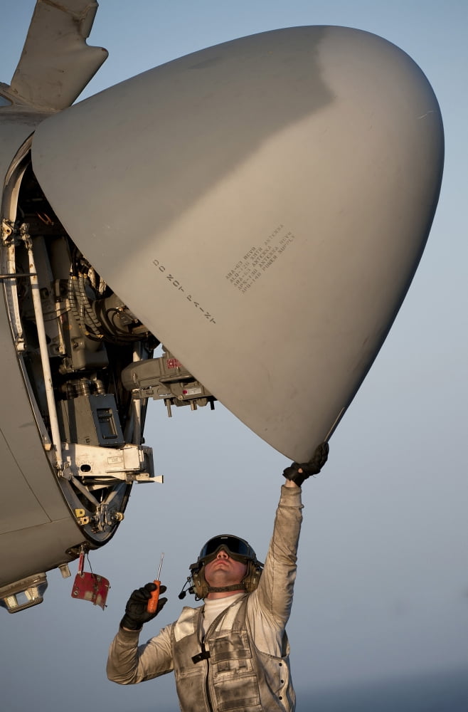 Petty Officer inspects the radar of an EA-6B Prowler Canvas Art - Stocktrek Images (23 x 35)