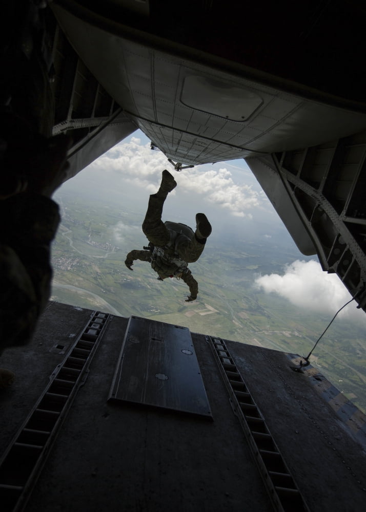 Philippine Army soldier jumps from a CH-53E Super Stallion Canvas Art - Stocktrek Images (24 x 33)