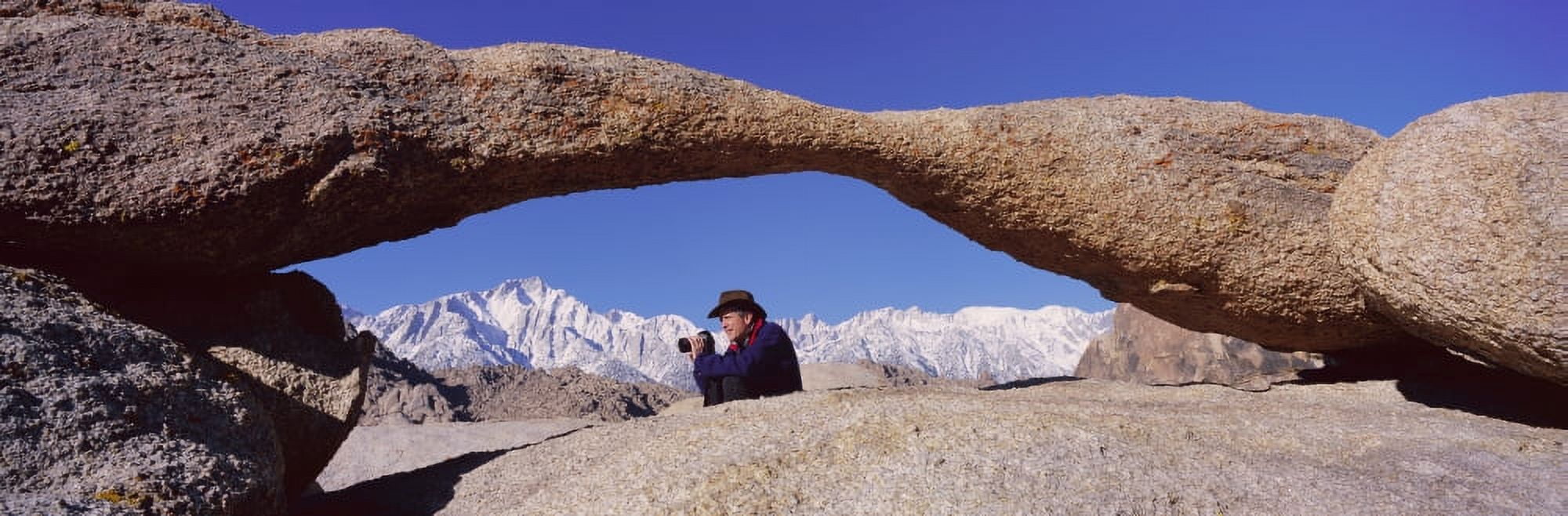 Photographer Joe Sohm with panoramic camera frames shot of Mount Whitney through Alabama Hills Arch in Alabama Hills near Lone Pine California Canvas Art - Panoramic Images (36 x 12)