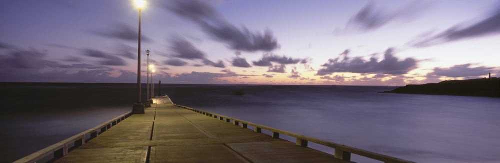 Pier And Coastline Just Before Dawn Canvas Art - Ian Cumming Design Pics (44 x 14)