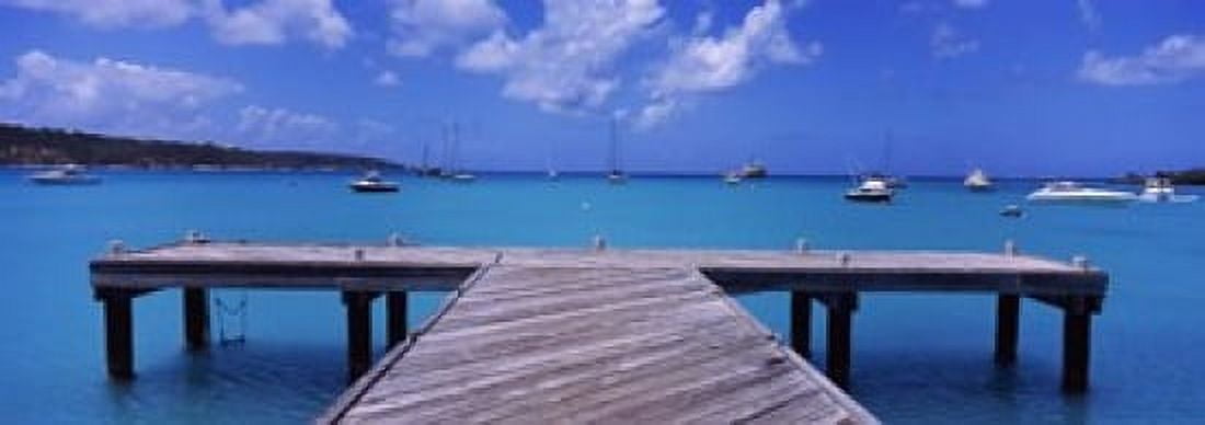 Pier with boats in the background Sandy Ground Anguilla Canvas Art - Panoramic Images (18 x 7)
