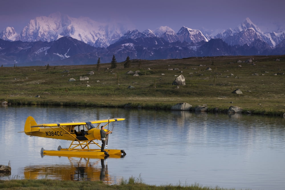 A Pilot Fly Fishes From His Super Cub Floatplane On An Unnamed Lake In Southcentral Alaska With Alaska Range In The Background Summer Canvas Art - Jeff Schultz Design Pics (34 x 22)