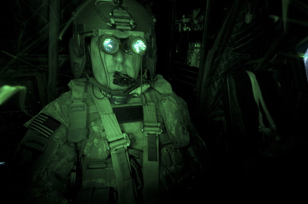 Pilot equipped with night vision goggles in the cockpit of a CH-47 Chinook Canvas Art - Terry MooreStocktrek Images (35 x 23)