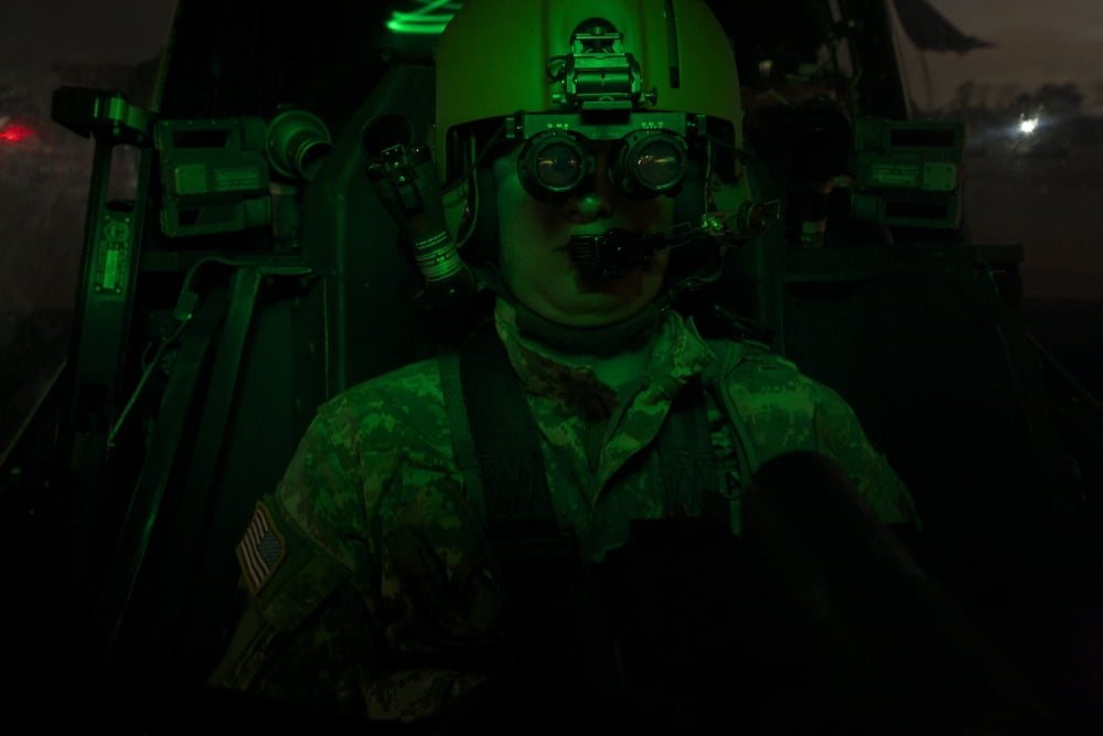 Pilot equipped with night vision goggles in the cockpit of an Apache helicopter Canvas Art - Terry MooreStocktrek Images (18 x 12)