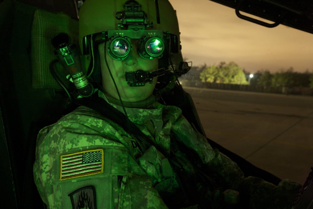 Pilot equipped with night vision goggles in the cockpit of an Apache helicopter Canvas Art - Terry MooreStocktrek Images (18 x 12)