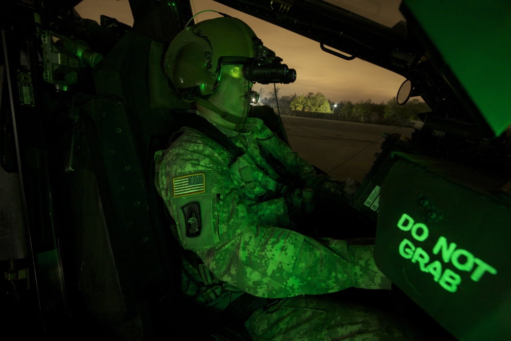 Pilot equipped with night vision goggles in the cockpit of an Apache helicopter Canvas Art - Terry MooreStocktrek Images (18 x 12)
