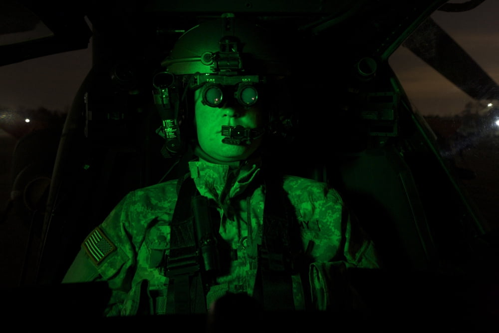 Pilot equipped with night vision goggles in the cockpit of an Apache helicopter Canvas Art - Terry MooreStocktrek Images (35 x 24)