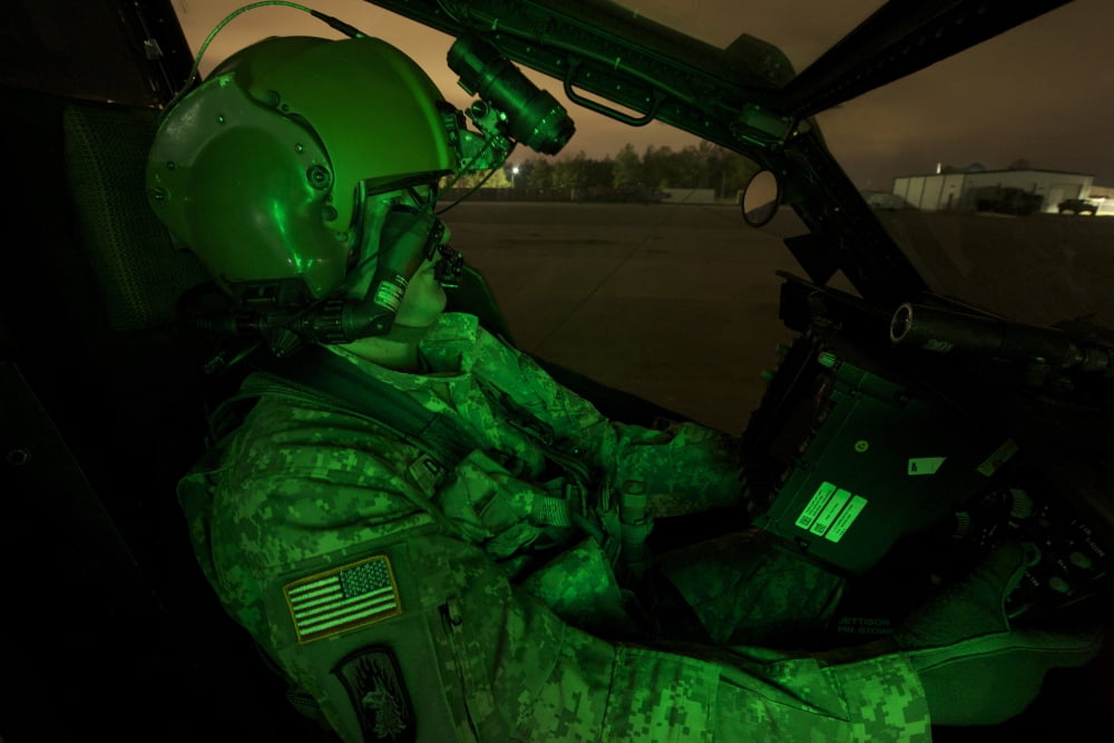 Pilot equipped with night vision goggles in the cockpit of an Apache helicopter Canvas Art - Terry MooreStocktrek Images (35 x 24)