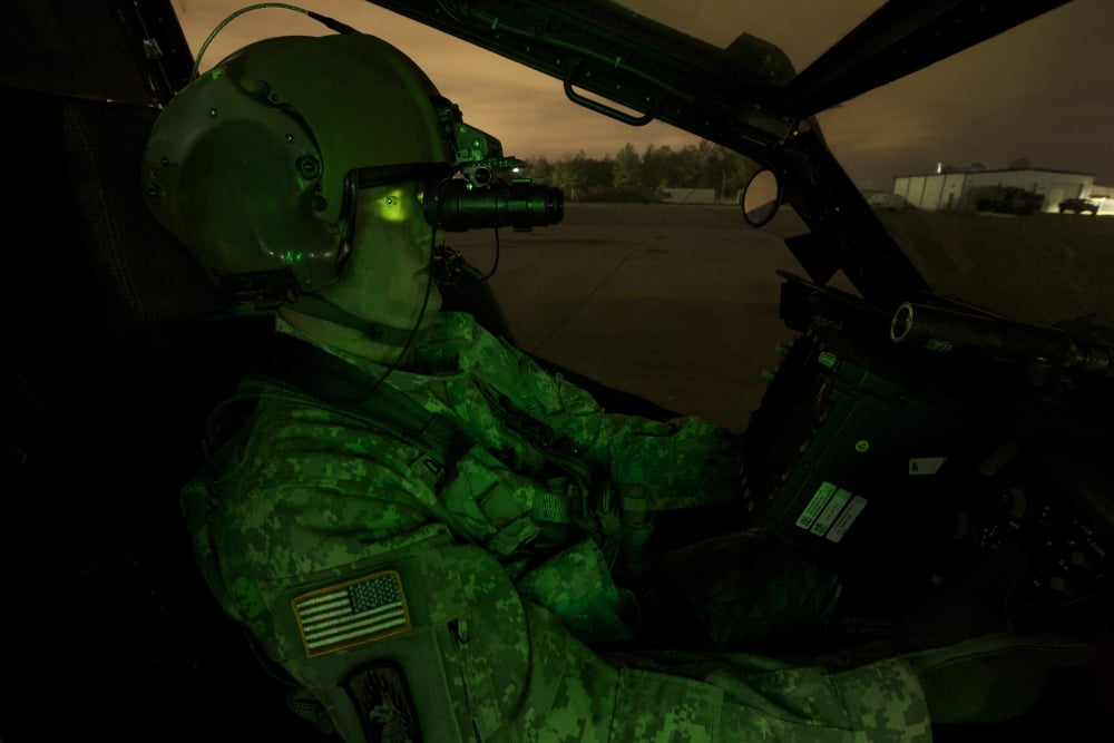 Pilot equipped with night vision goggles in the cockpit of an Apache helicopter Canvas Art - Terry MooreStocktrek Images (35 x 24)