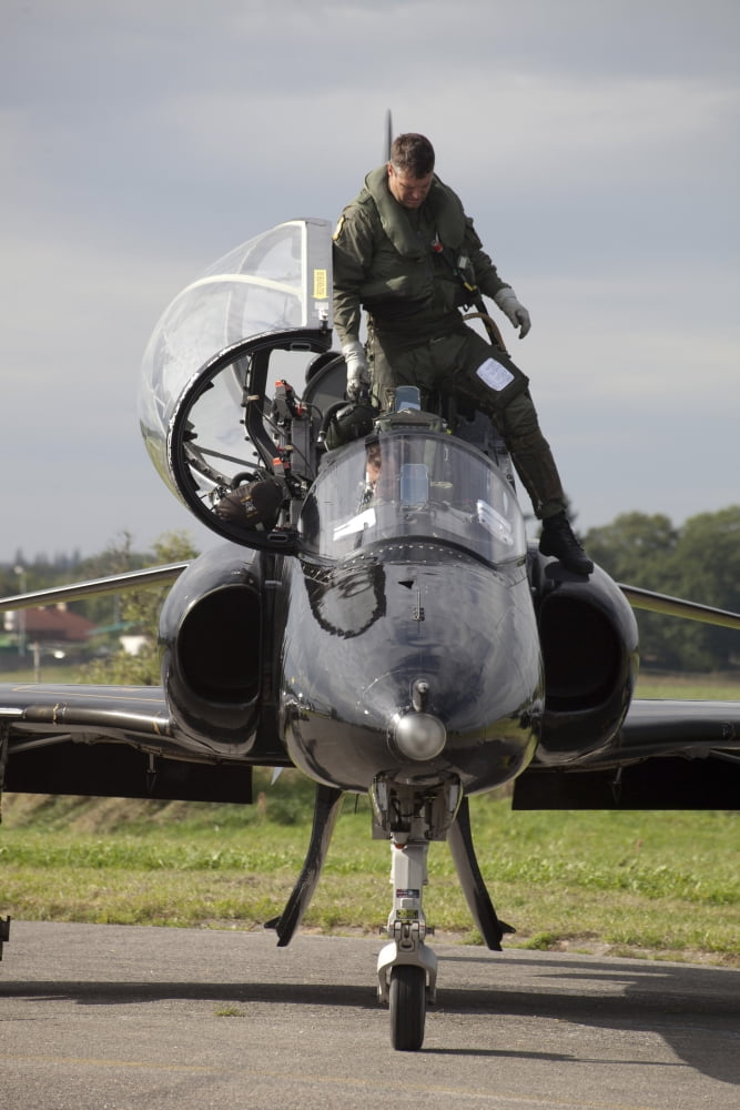 Pilot exiting out of aircraft Canvas Art - Timm ZiegenthalerStocktrek Images (23 x 35)