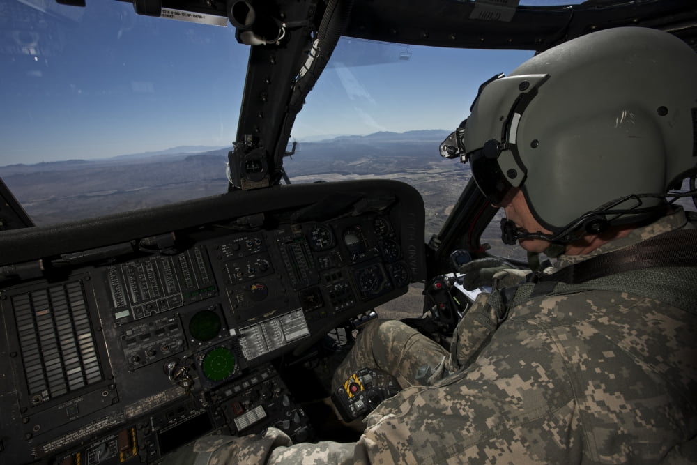 Pilot operating the cockpit of a UH-60 Black Hawk helicopter Canvas Art - Terry MooreStocktrek Images (18 x 12)