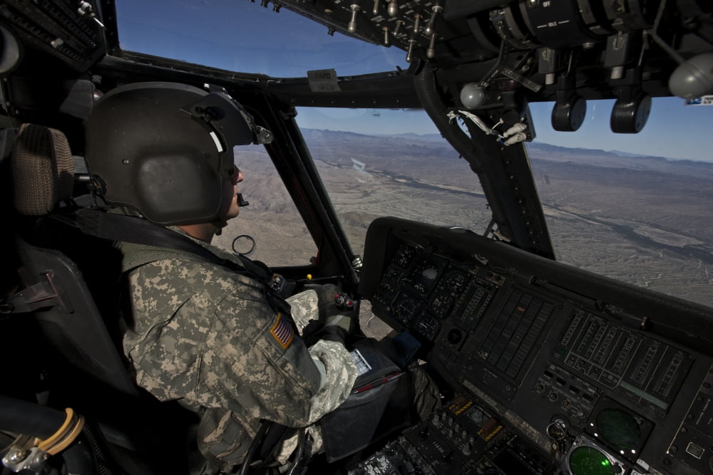 Pilot operating the cockpit of a UH-60 Black Hawk helicopter Canvas Art - Terry MooreStocktrek Images (18 x 12)