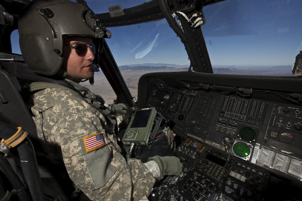 Pilot operating the cockpit of a UH-60 Black Hawk helicopter Canvas Art - Terry MooreStocktrek Images (18 x 12)
