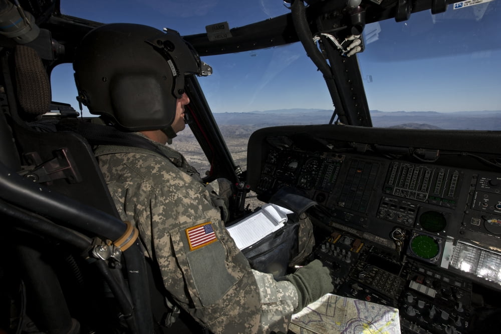 Pilot operating the cockpit of a UH-60 Black Hawk helicopter Canvas Art - Terry MooreStocktrek Images (18 x 12)