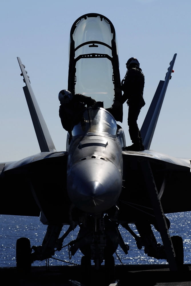 Pilots conducts a pre-flight inspection on an FA-18F Super Hornet Canvas Art - Stocktrek Images (23 x 34)