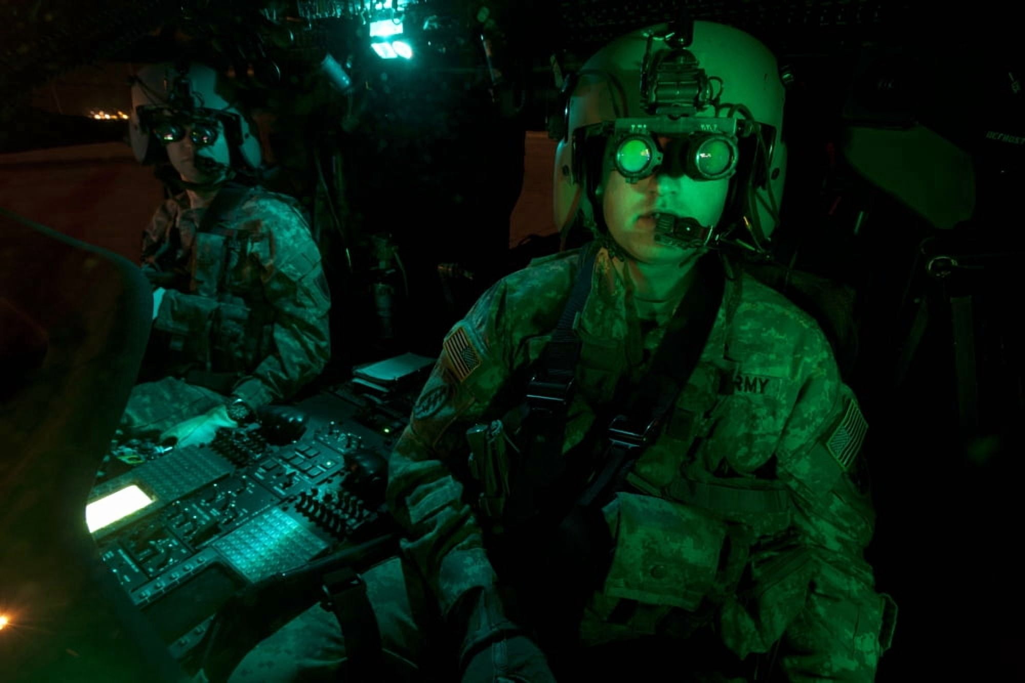 Pilots equipped with night vision goggles in the cockpit of a UH-60 Black Hawk Canvas Art - Terry MooreStocktrek Images (18 x 12)