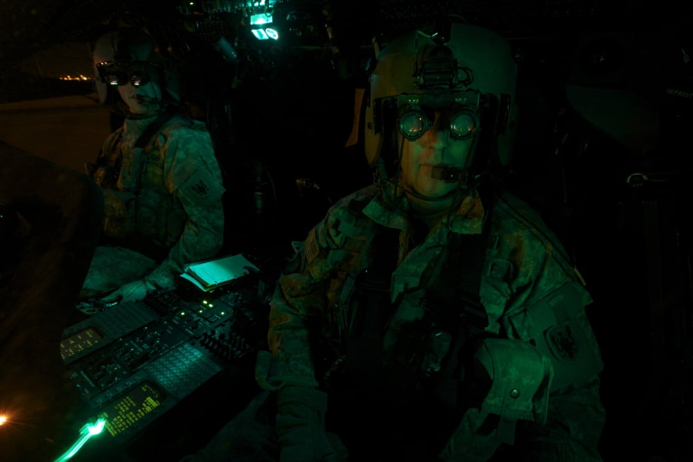 Pilots equipped with night vision goggles in the cockpit of a UH-60 Black Hawk Canvas Art - Terry MooreStocktrek Images (18 x 12)
