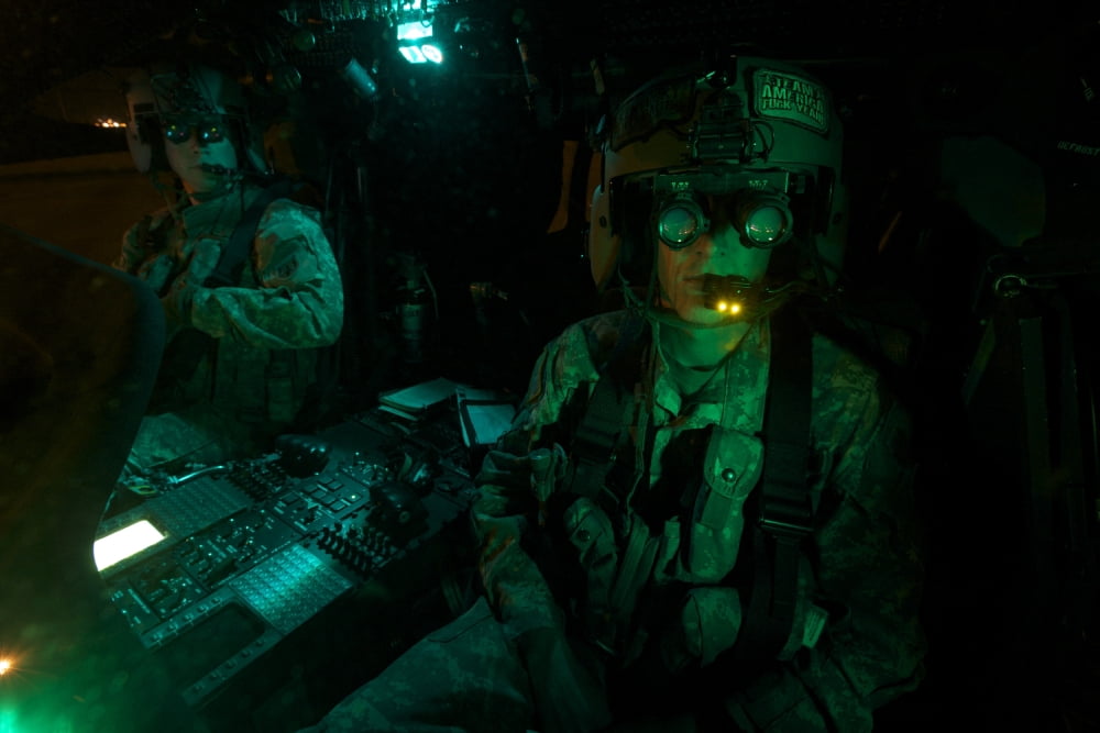 Pilots equipped with night vision goggles in the cockpit of a UH-60 Black Hawk Canvas Art - Terry MooreStocktrek Images (18 x 12)