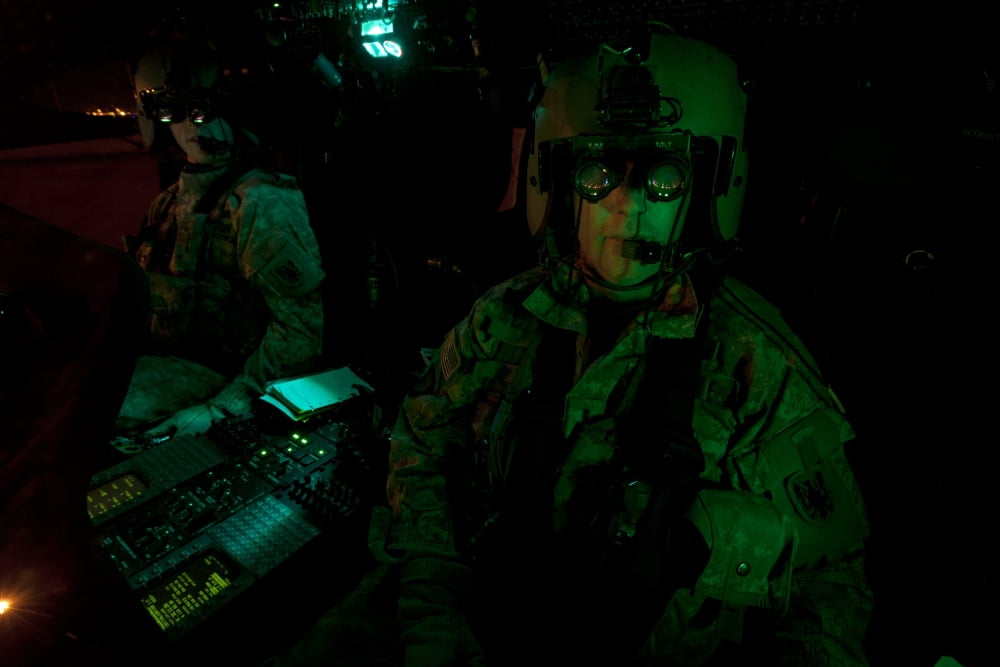 Pilots equipped with night vision goggles in the cockpit of a UH-60 Black Hawk Canvas Art - Terry MooreStocktrek Images (18 x 12)
