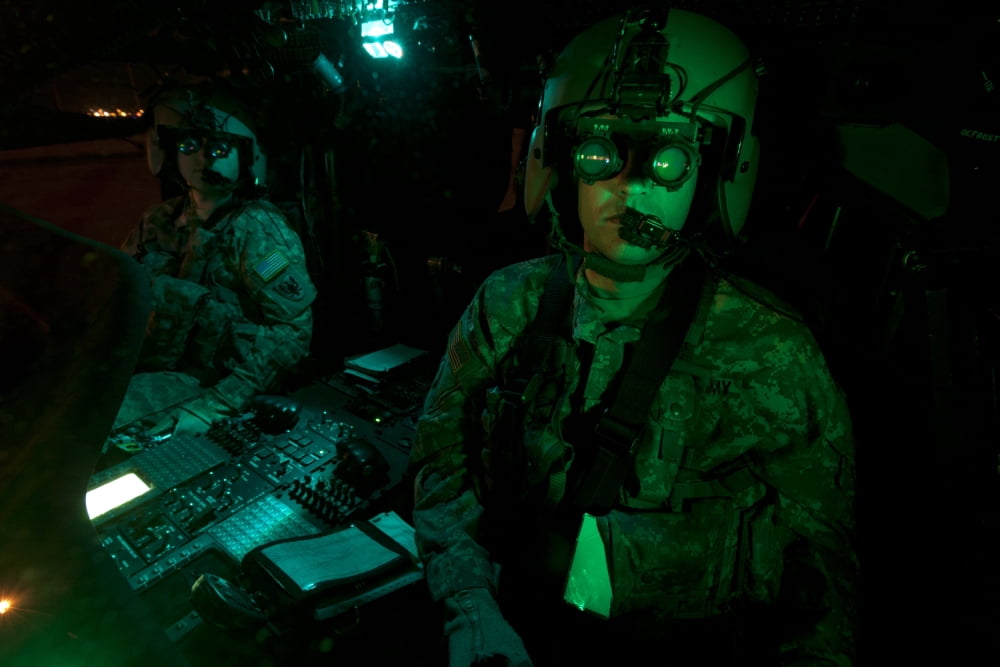 Pilots equipped with night vision goggles in the cockpit of a UH-60 Black Hawk Canvas Art - Terry MooreStocktrek Images (35 x 23)