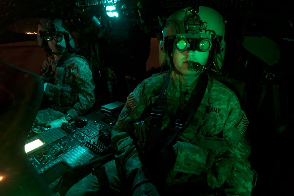 Pilots equipped with night vision goggles in the cockpit of a UH-60 Black Hawk Canvas Art - Terry MooreStocktrek Images (35 x 23)