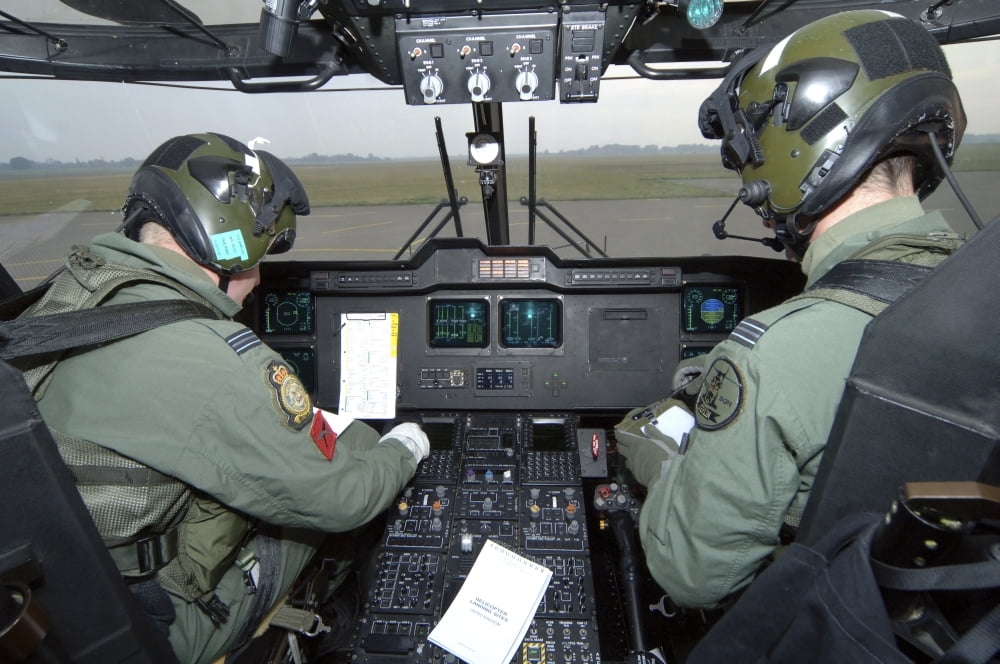 Pilots inside the cockpit of a Royal Air Force Merlin Helicopter at RAF Lyneham Canvas Art - Andrew ChittockStocktrek Images (34 x 23)