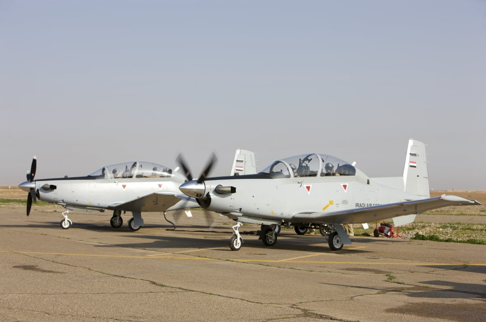Pilots perform a pre-flight on their T-6 Texan trainer aircraft Canvas Art - Terry MooreStocktrek Images (18 x 12)